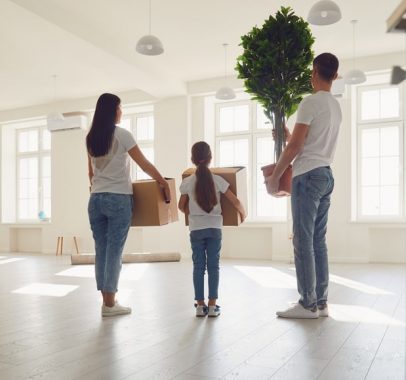 Happy Family With Children Moving With Boxes — Furniture Removal in Coffs Harbour, NSW