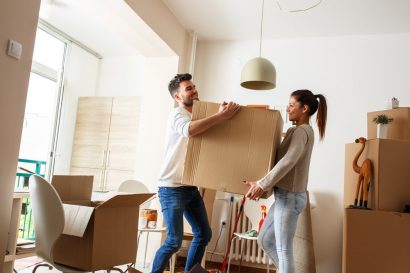 Couple working together moving boxes — Furniture Removal in Coffs Harbour, NSW